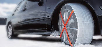 AutoSock/Auto Sock - textile wheel covers with an elasticated edge; you just slip them over the driving wheels when you find yourself getting stuck. ("Yes - it really is this easy" and "Yes, of course they work!")