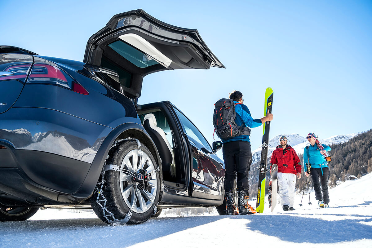 Konig K-Summit XXL snow chains fitted to the rear wheels of a Tesla Model X