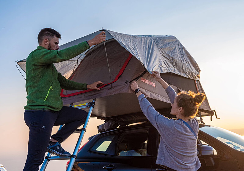 yakima skyrise on roof tents on vehicles by the sea